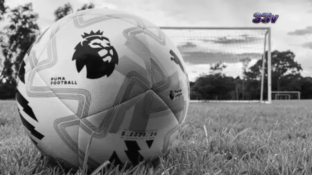 Logo MrQ dan branding Bournemouth di lapangan sepak bola